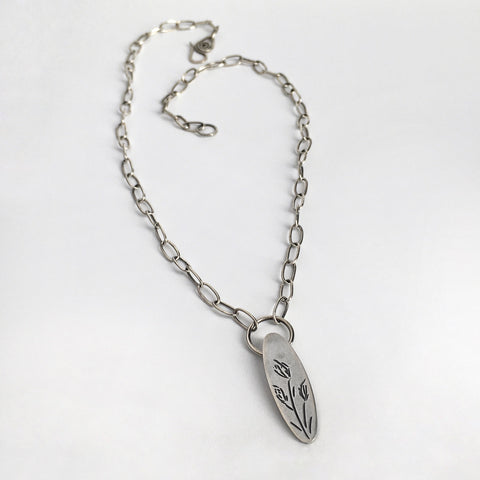 Silver Floral Pendant with Hand Carved Design